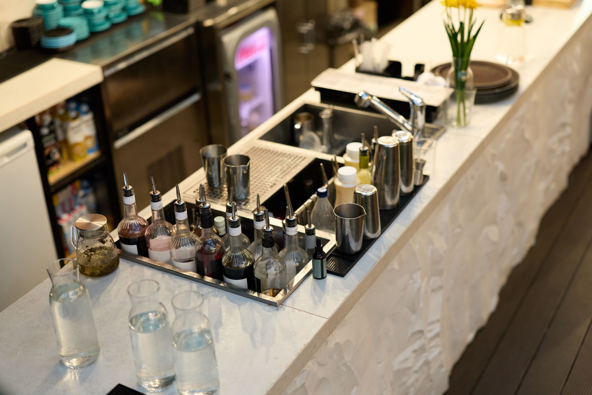 An Elegant Bar Setup Featuring an Assortment of Mixology Tools and Various Spirits
